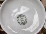 a white bowl with a star on it sitting on a table