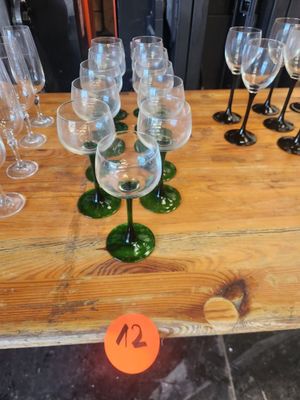 many wine glasses sitting on a table with a price tag