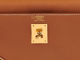 a brown purse with a gold buckle on the front