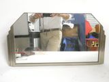 a man taking a picture of himself in a mirror