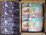 boxes of children ' s clothing are packed with unicorns and rainbows