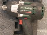 a cordless drill that is attached to the wall