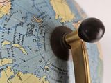 a close up of a globe with a handle on it