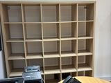 a desk with a phone and a printer on it