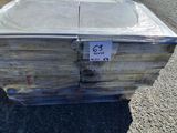 a stack of boxes sitting on the side of the road