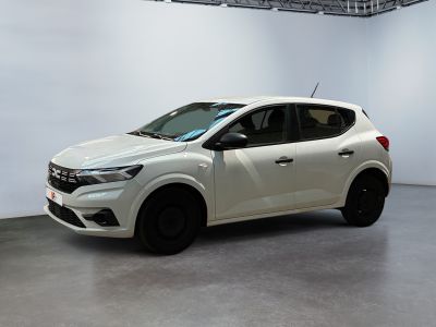 the white car is parked in a large room with white walls