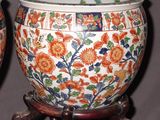 two vases that have been decorated with flowers on them