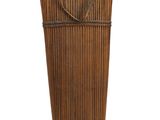 a large bamboo basket with a handle on a white background
