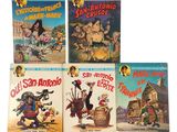 quatre livres pour enfants sont alignés sur une surface blanche
