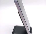 a cell phone that is sitting on a stand