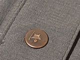 a button on a shirt that has a number on it