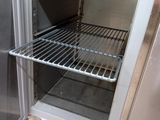 an open refrigerator that is sitting in a kitchen
