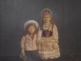 a painting of two children standing next to each other