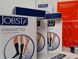 several boxes of jobst gauzettes sitting on a table