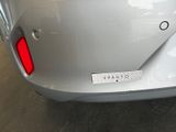 a close up of the rear end of a silver car