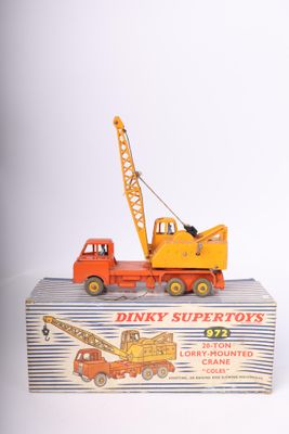 a toy truck with a crane on top of it