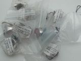 a bunch of small vials in a bag on a table