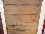 a wooden door that has a metal handle on it
