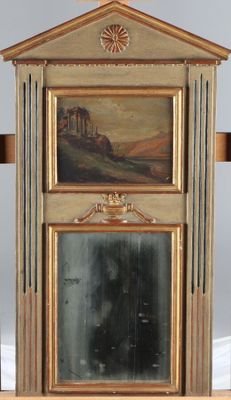 a mirror with a painting on it and a cross in front of it