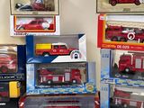 many different types of toy fire trucks on the table