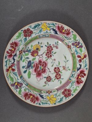 a plate with a floral design on it on a table