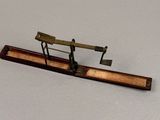 a miniature model of an airplane on a wooden stand