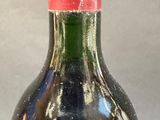 a bottle of wine that is sitting on a table