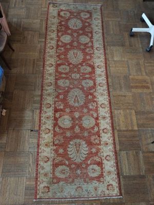 a long rug on the floor in a room