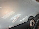 a sticker on the hood of a car that has a sticker on it