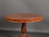 a round table with a wooden top on a pedestal