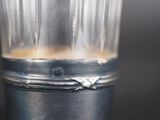 a close up of a blender with a liquid inside of it