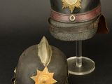 pair of helmets with a star on the top and a star on the bottom