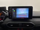 the dashboard of a car with a gps device on the dashboard