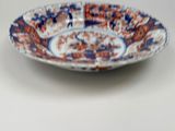 a blue and orange plate with a design on it