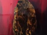 a painting of a gorilla sitting on a red wall