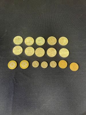 a close up of a pile of coins on top of a table