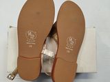 pair of women ' s shoes in a box on a white surface