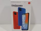 packaging of a redmik c phone in a box on a white surface
