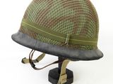 an image of a helmet on a stand on a white background