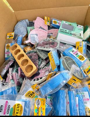 a cardboard box filled with assorted household items