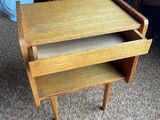an image of a small table with a drawer in it