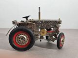 a model of a tractor made out of metal