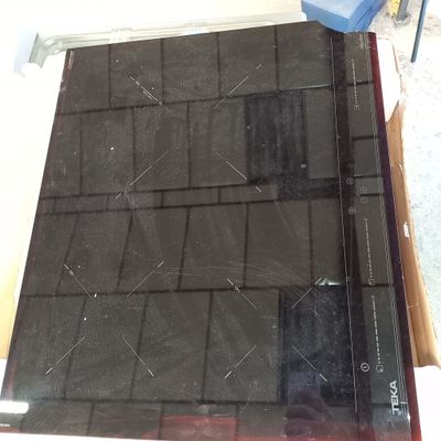 a picture of a black tile on top of a wooden table