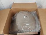 a cardboard box with a computer in it on a table