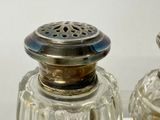 two salt and pepper shakers sitting on a table
