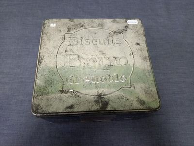 an old tin box with the words biscuits biscuits on it