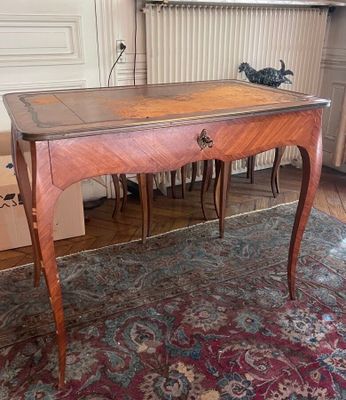 a wooden table with a drawer on top of it