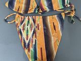 an image of a bikini top with a tie around the bottom