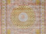 an oriental rug with a medallion design in yellow and pink
