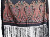 an image of a scarf with fringes hanging on a wall
